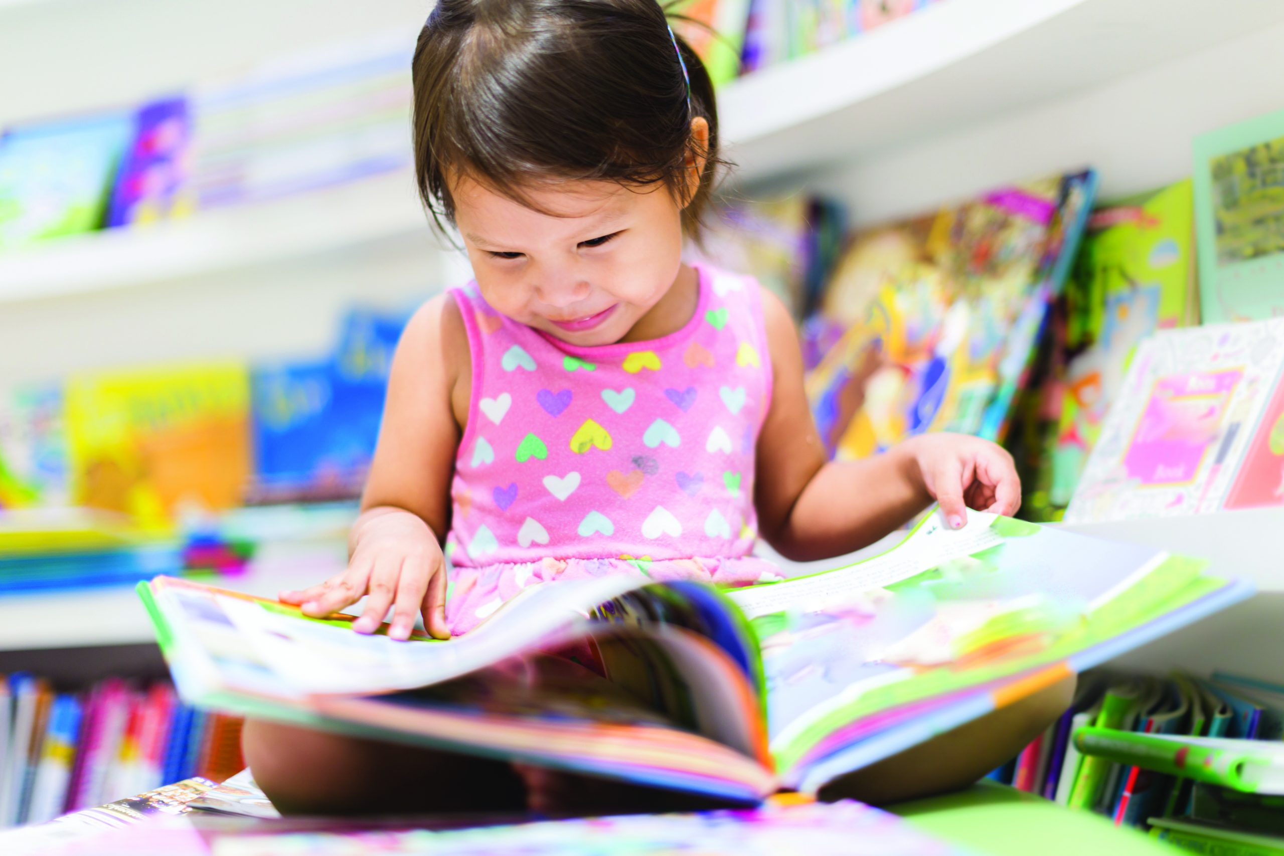 A child reading a picture book.