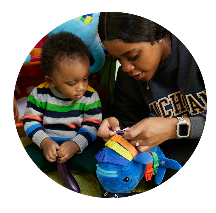 Educator engaging with infant